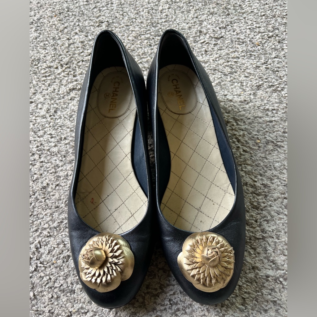Chanel Black Flats With Gold Camillia Detail